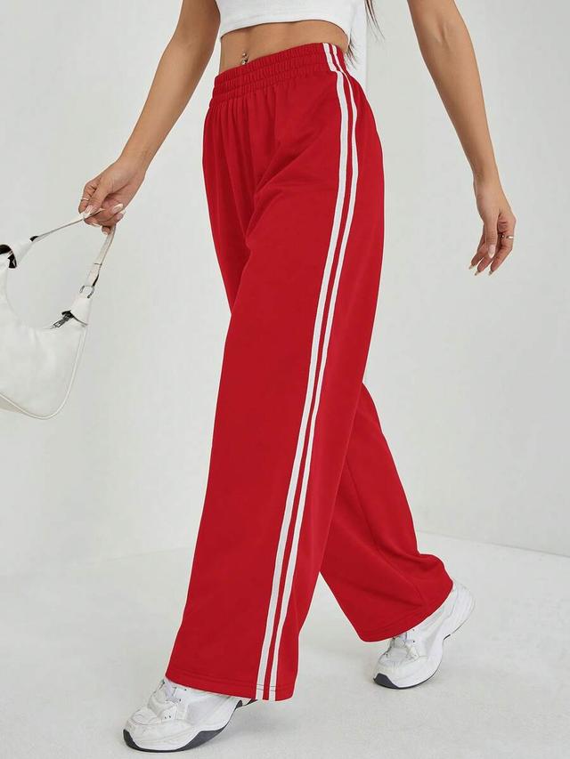 red wide leg sweatpants with side stripe