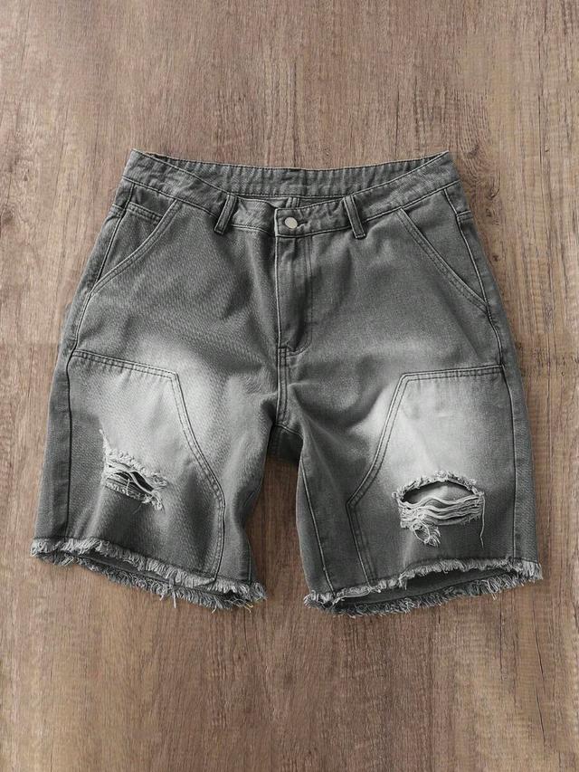 grey washed denim shorts with frayed edges and rips