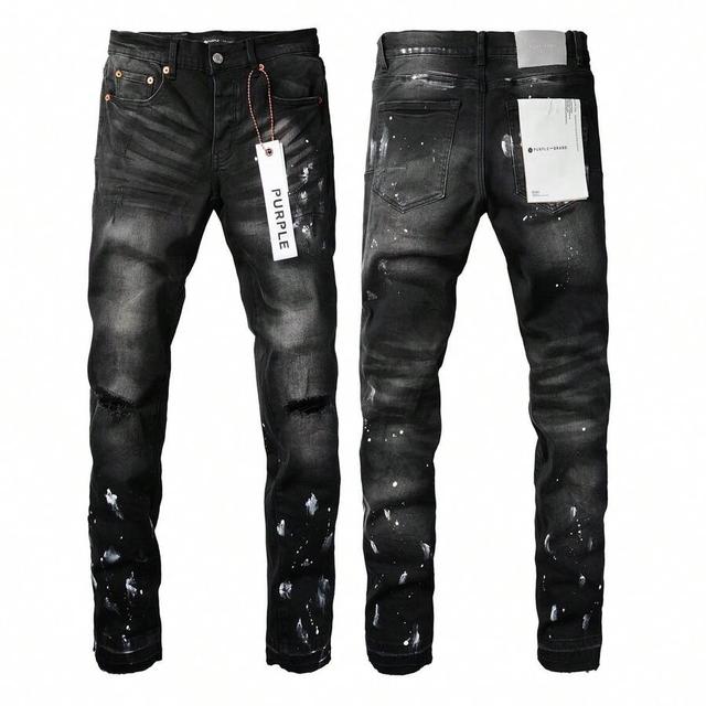 black distressed denim jeans with paint splatter