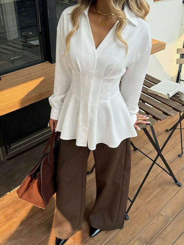 white waist cinched a-line long sleeve shirt