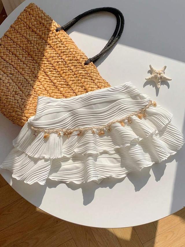 white textured ruffle cake skirt with ocean chain