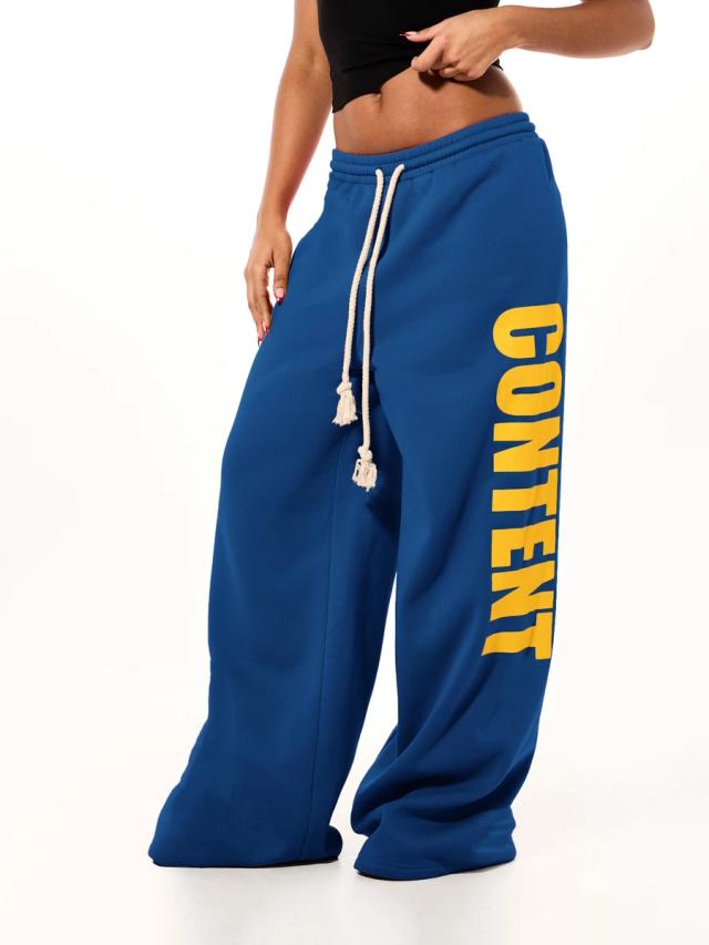 oversized blue wide leg sweatpants with vertical graphic print