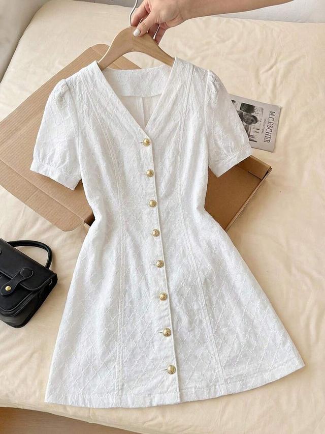 white v-neck short sleeve textured button front dress
