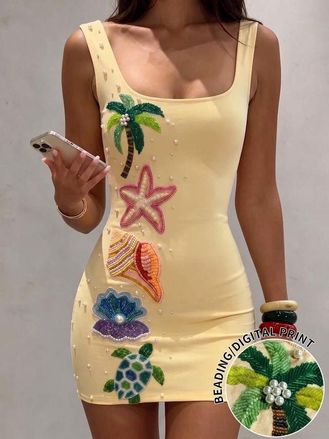yellow cotton mini dress with tropical beaded appliqués