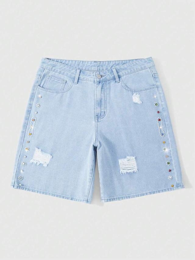 light wash distressed denim shorts with rhinestone embellishments
