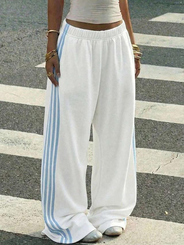 white knit wide leg sweatpants with green ribbon