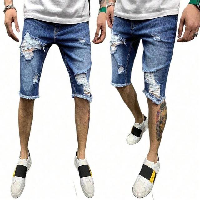 distressed blue denim shorts with raw hem