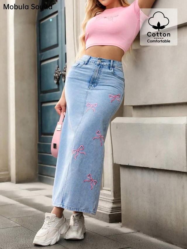 light wash denim midi skirt with pink bow embroidery