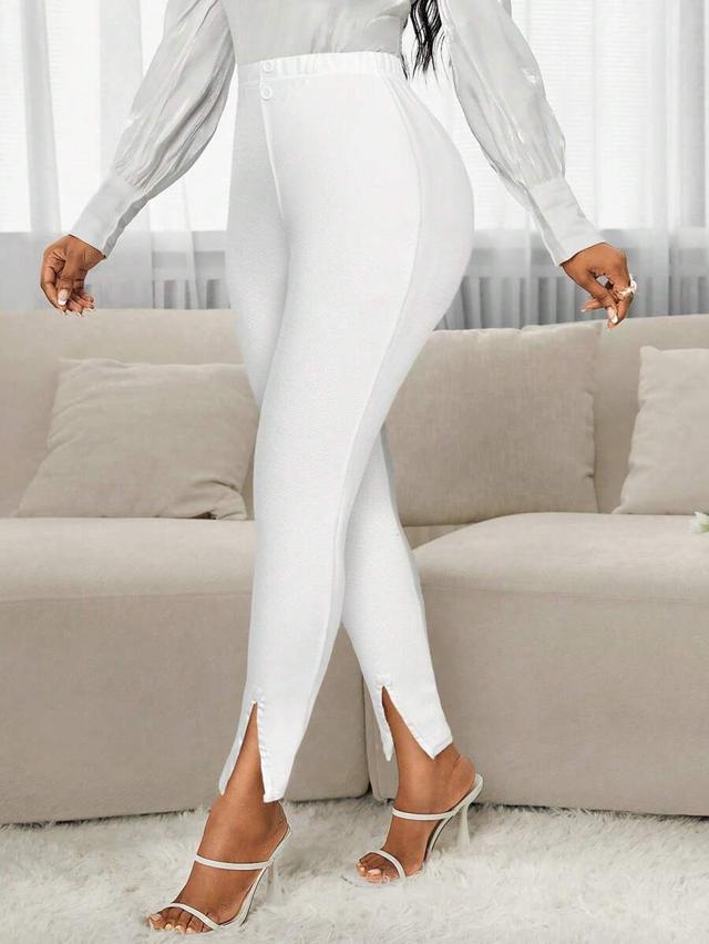 white textured slim fit ankle pants with side slits
