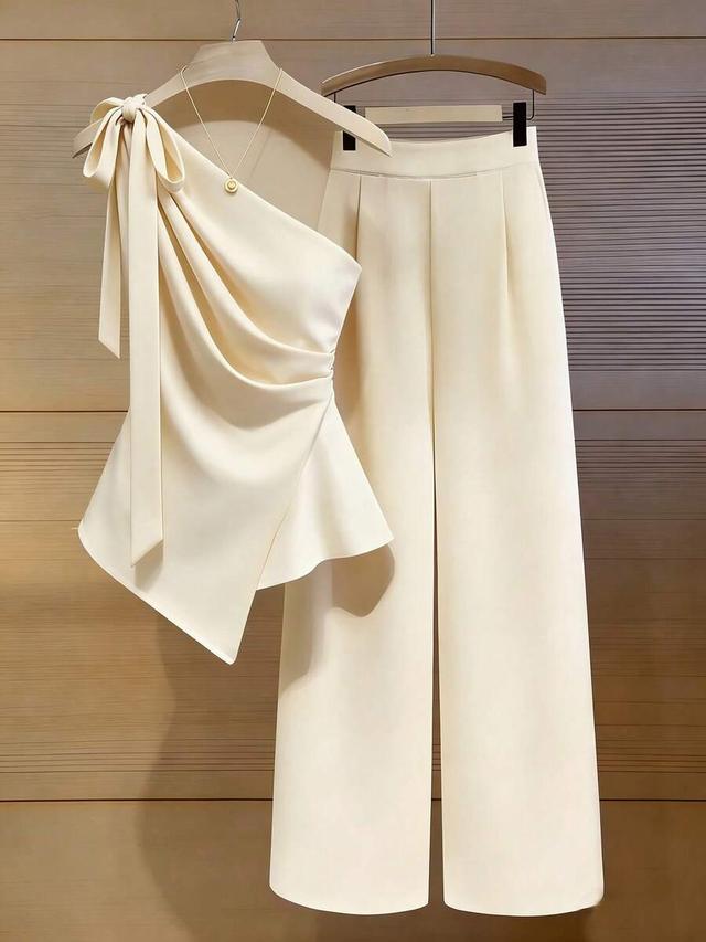 cream white tie-strap asymmetric hem top and pants set