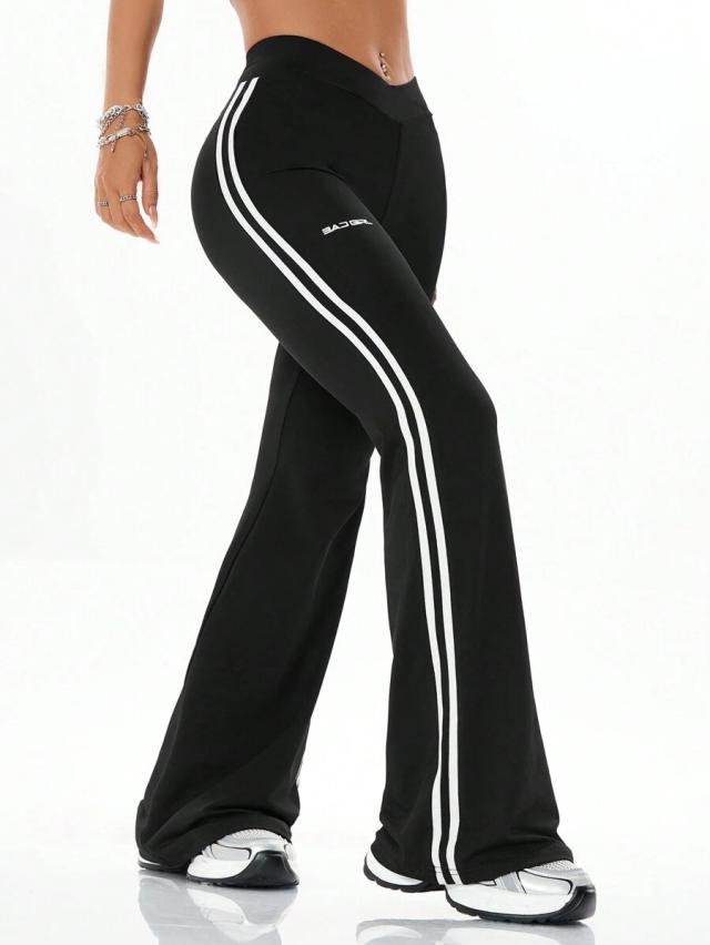 black stretchy athleisure boot cut pants with side stripes