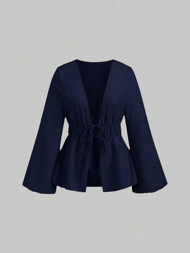 navy blue long sleeve lace-up peplum top