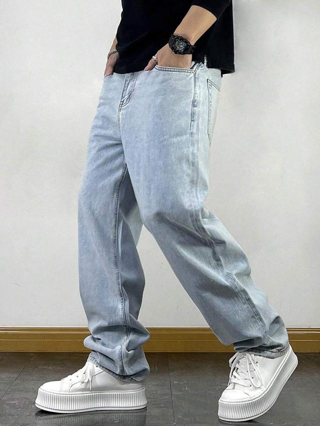 light blue washed loose fit straight leg denim jeans