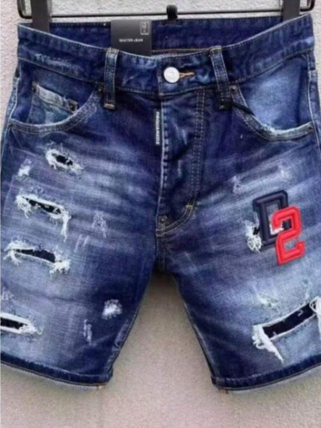 distressed blue denim shorts with embroidered patch
