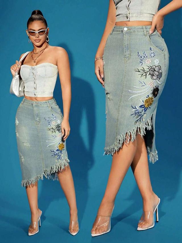 light wash denim midi skirt with floral embroidery