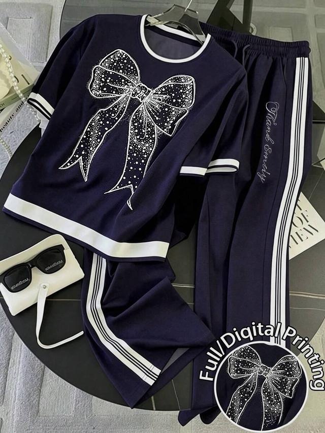 navy blue crew neck t-shirt with rhinestone bow