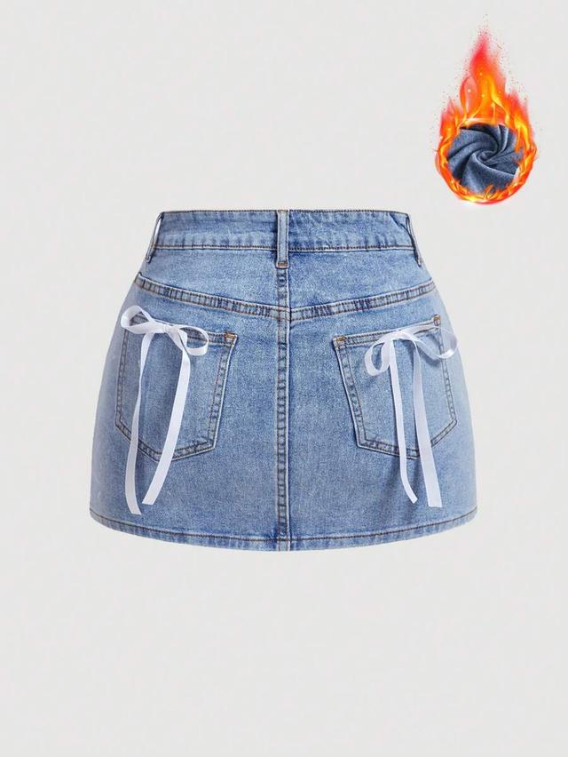 light wash denim mini skirt with ribbon bow detailing