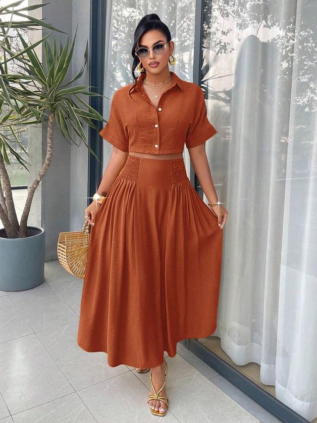 lime yellow short sleeve cropped shirt and pleated skirt