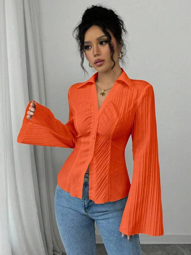 orange pleated french style cinched waist blouse
