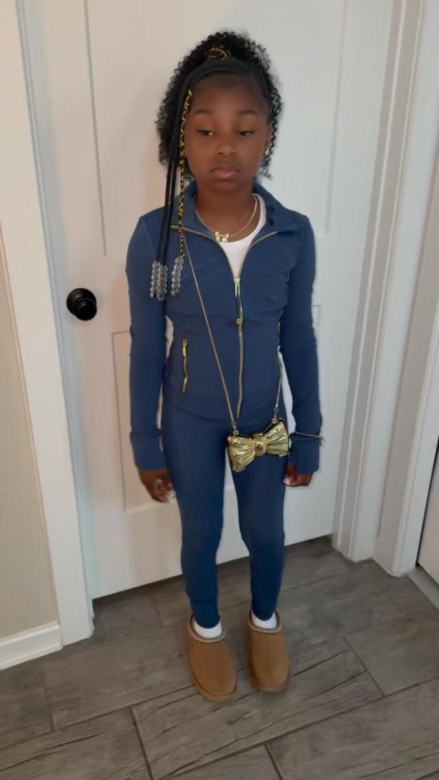 navy blue zip-up athletic jacket with gold hardware