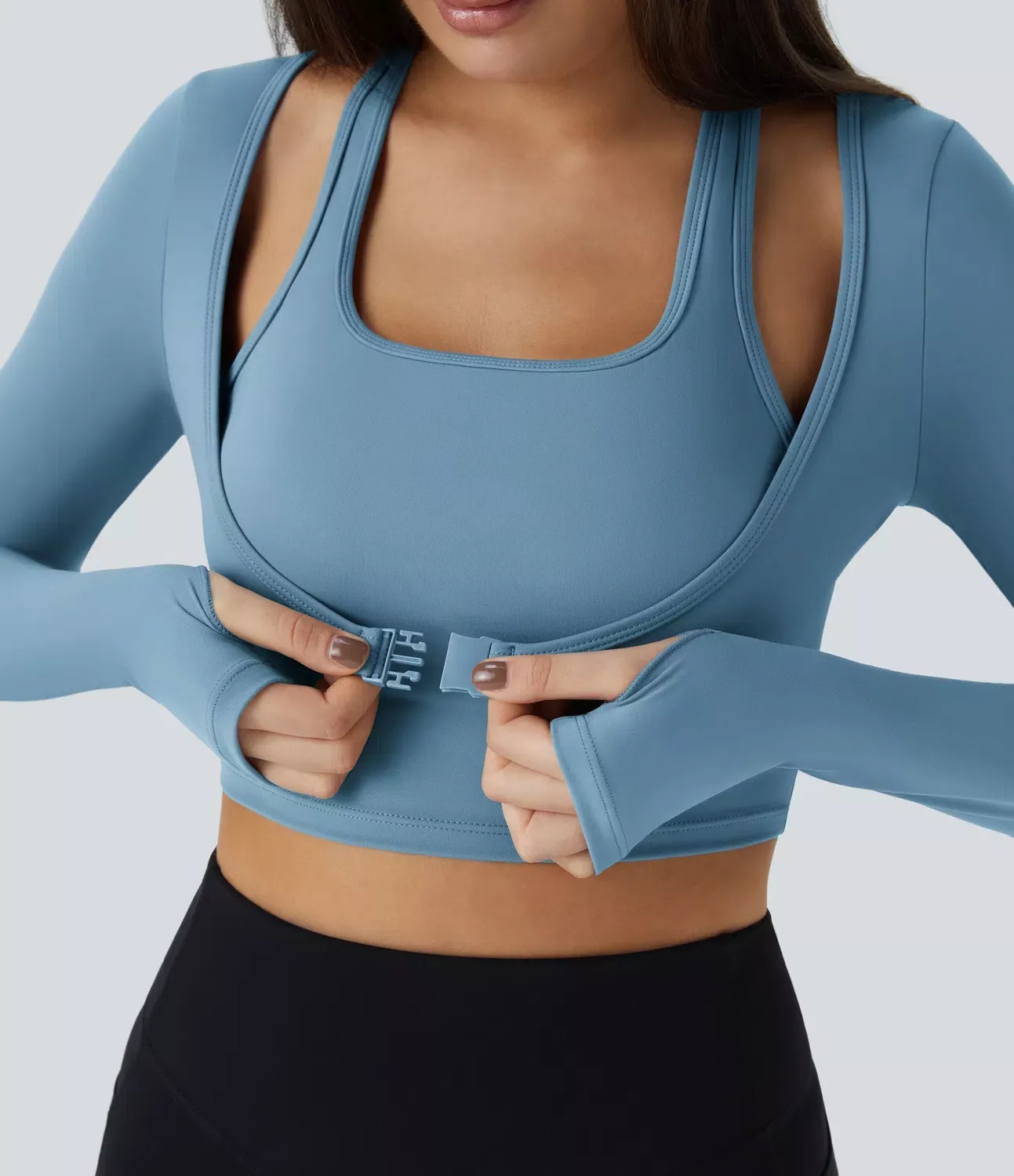 blue long sleeve activewear crop top with buckle