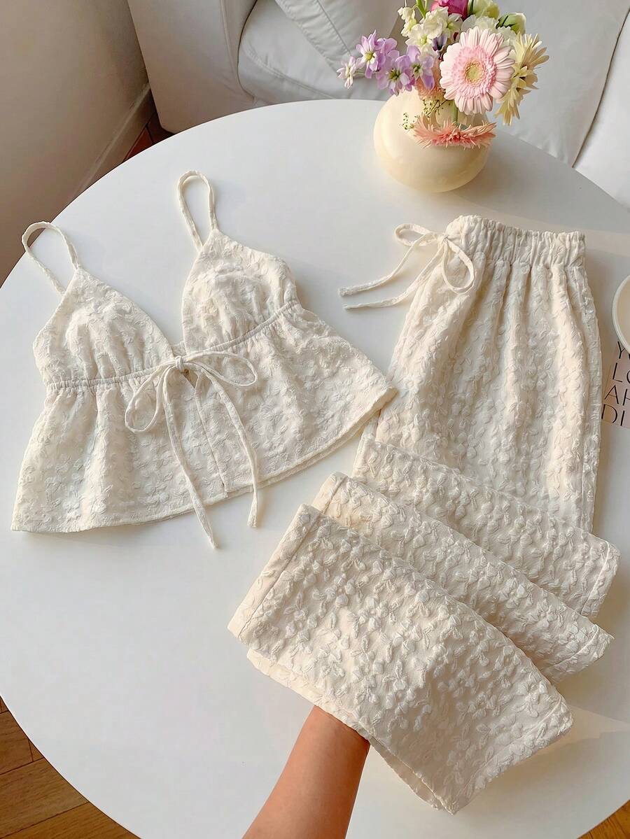 cream textured camisole and matching wide-leg trousers set