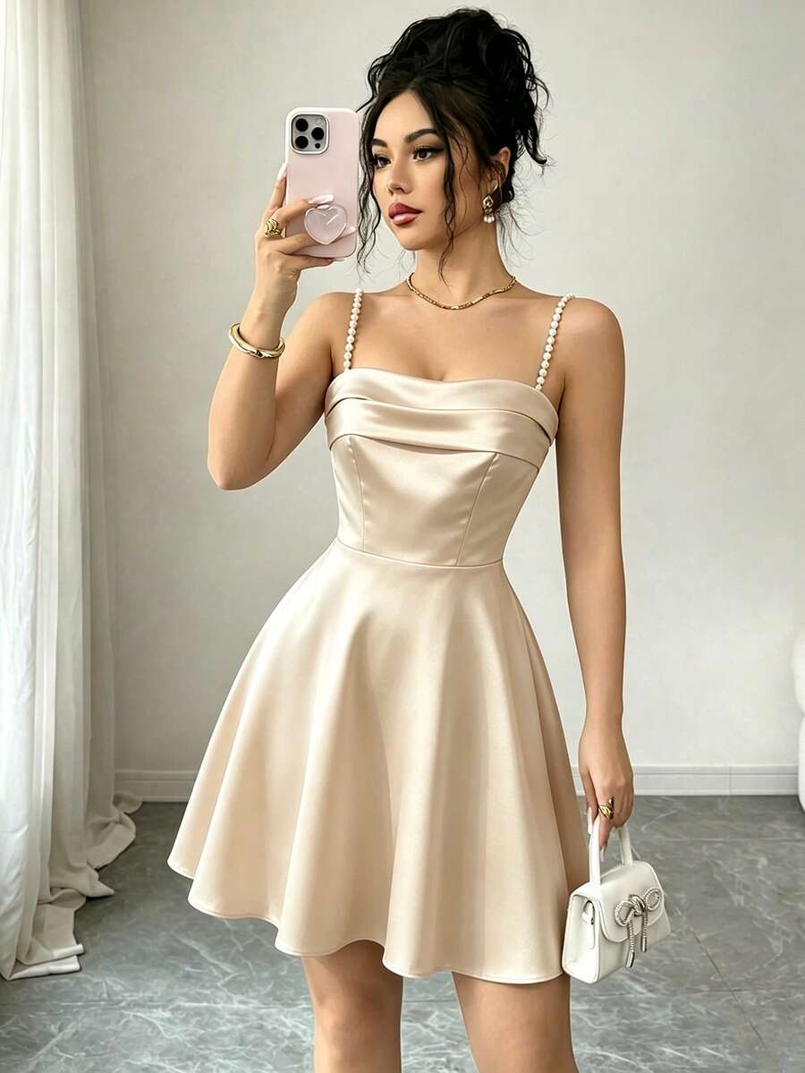 sleeveless champagne satin mini dress with pearl straps
