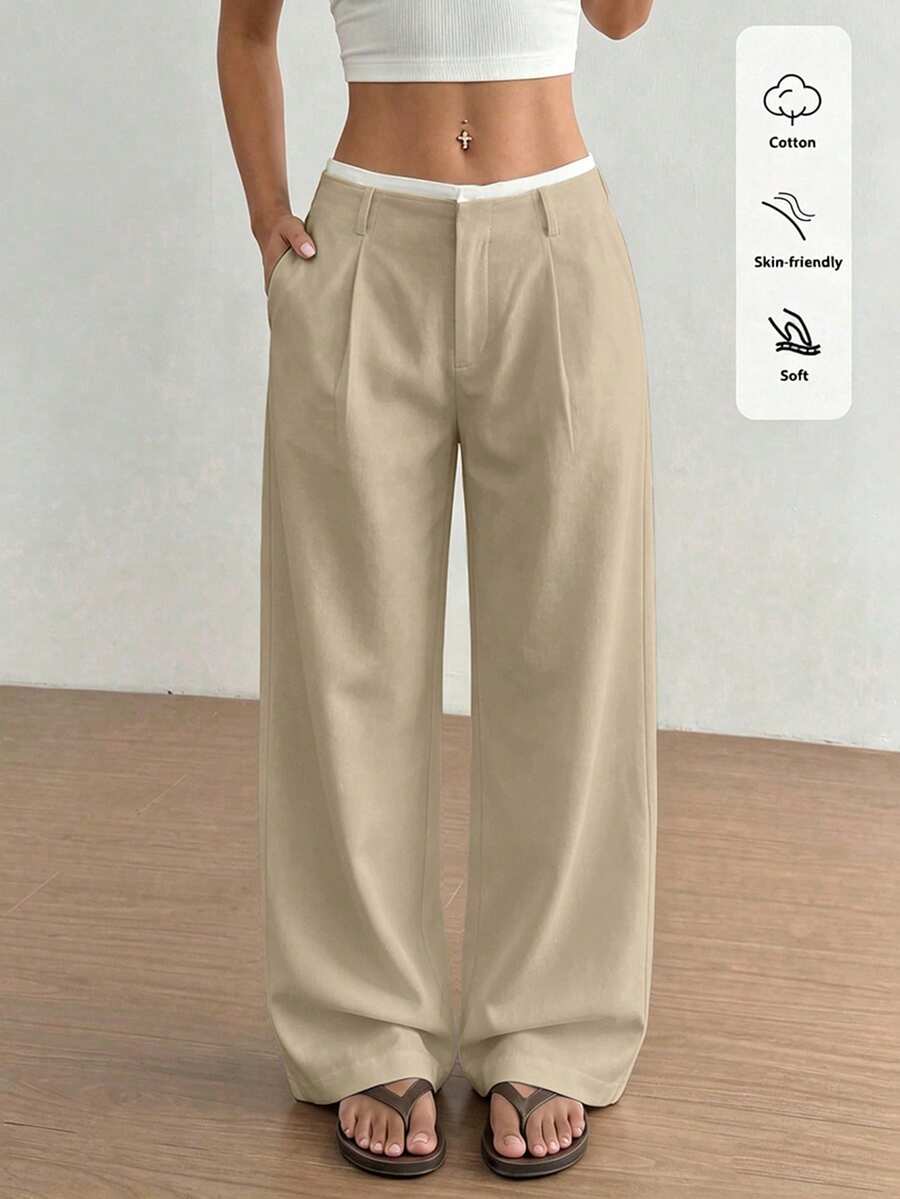 high-waisted beige straight leg tailored trousers