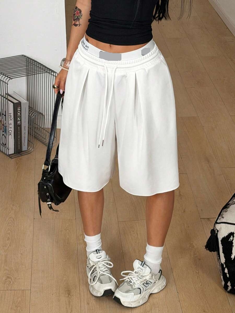 white baggy low rise bermuda shorts