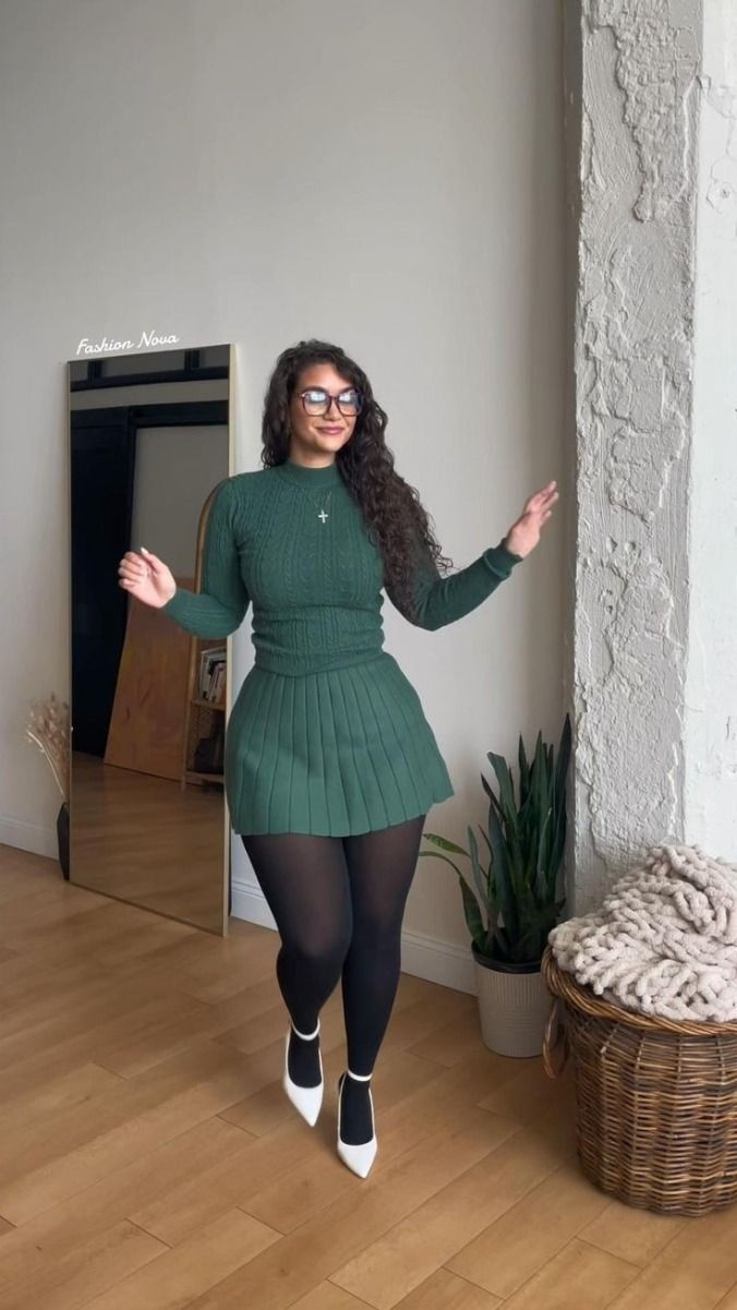 dark green cable knit sweater and matching pleated mini skirt