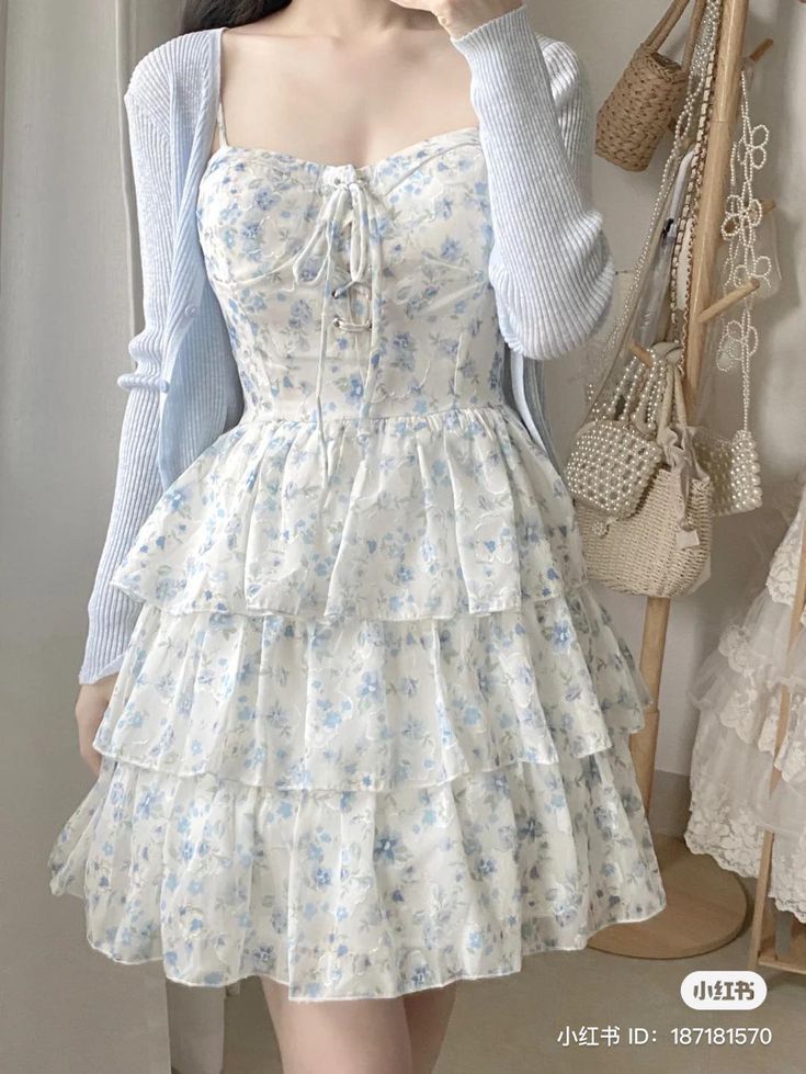 light blue ribbed cardigan over floral corset top